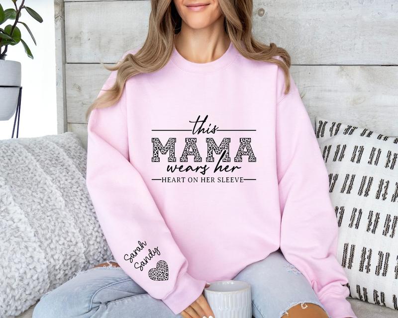 Custom Mama Sweatshirt With Kids Names On Sleeve, This Mama Wears Her Heart On Her Sleeve, Mom Christmas Crewneck Sweater, Mothers Day Gift for Mom